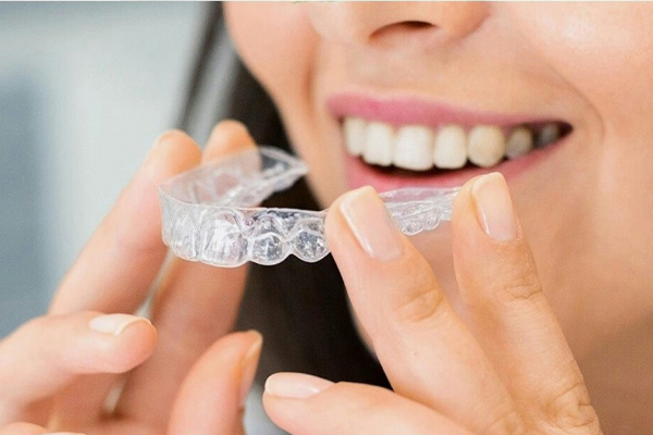 cosmetic-dentistry-near-bryn-mawr Woman being fit for aligners in Bryn Mawr Dental Arts Office