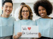 Happy patients with a sign that says we love dr. Lieberman